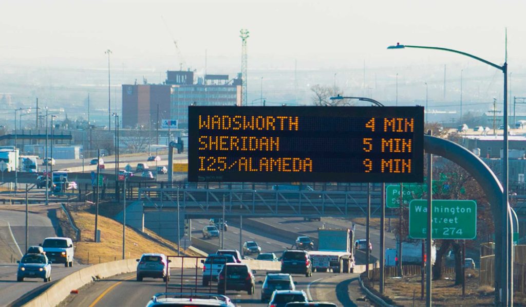 Dynamic message board displaying travel times on I-25 in Denver, Colorado