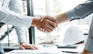 Business partners shake hands
